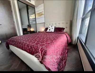Luxurious bedroom with elegant decor and large window view