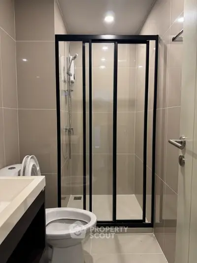 Modern bathroom with sleek shower enclosure and contemporary fixtures