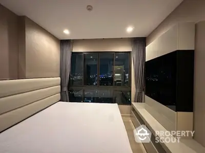 Luxurious bedroom with panoramic city view and modern furnishings