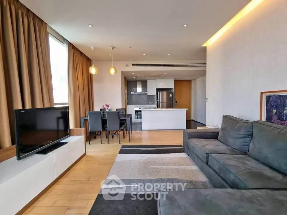 Spacious modern living room with open kitchen and stylish decor