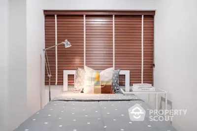 Cozy bedroom with modern decor and stylish blinds