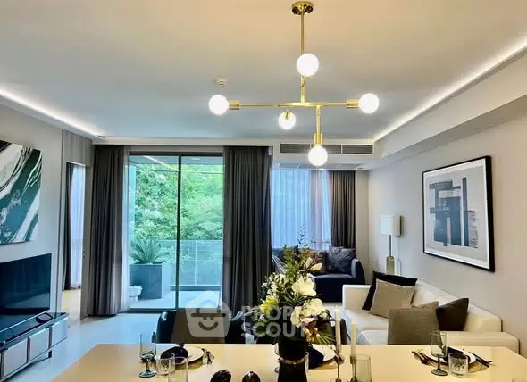 Modern living room with elegant decor and balcony view