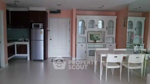 Charming kitchen and dining area with modern appliances and elegant cabinetry.