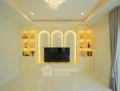 Luxurious living room with elegant built-in shelves and modern lighting