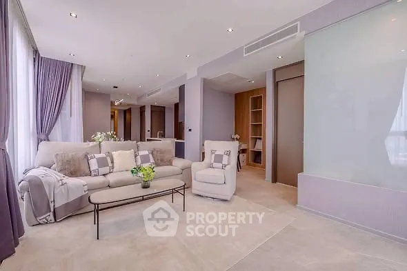 Luxurious modern living room with elegant decor and plush seating in a high-end apartment.