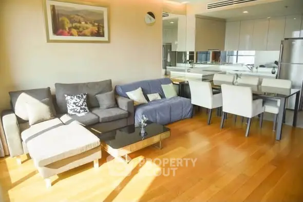 Spacious modern living room with elegant dining area and natural light