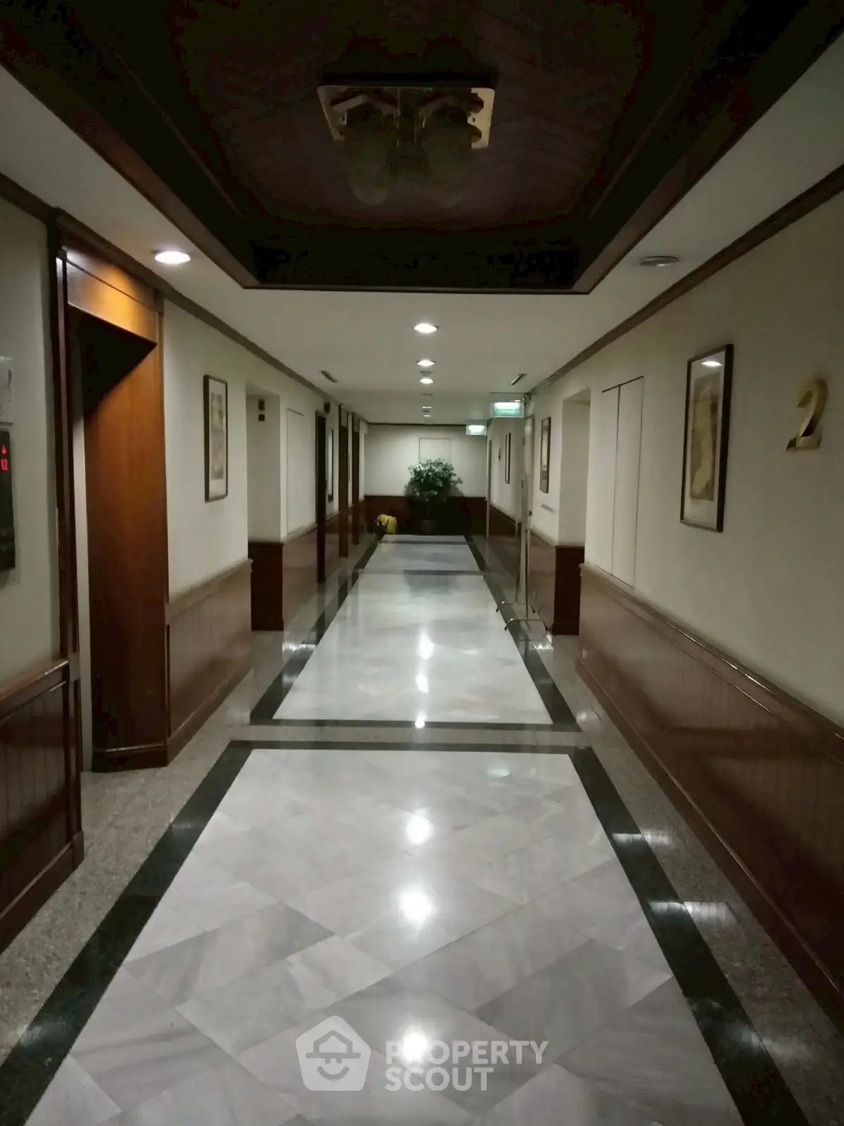 Luxurious hotel hallway with elegant marble flooring and ambient lighting