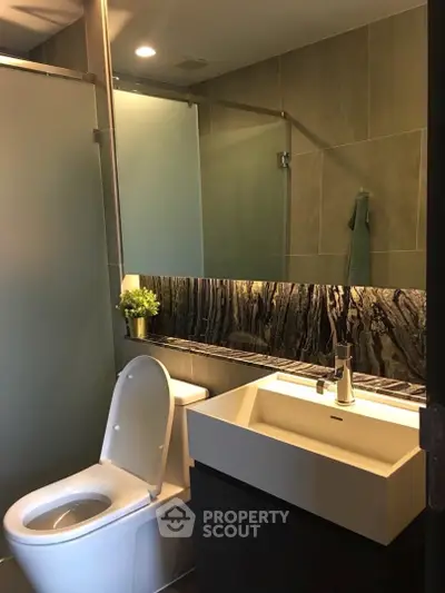 Modern bathroom with sleek fixtures and ambient lighting