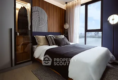 Modern bedroom with stylish decor and large window offering stunning city view.