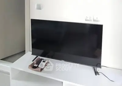 Modern living room with sleek TV setup and minimalist decor