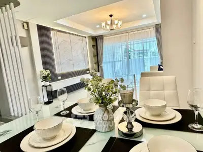 Elegant dining area with modern decor and natural light, perfect for entertaining guests.