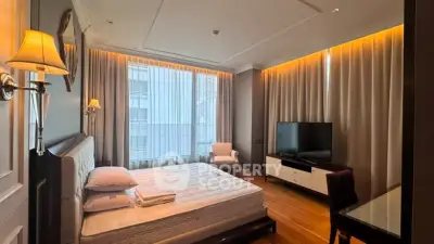 Luxurious bedroom with modern decor, large window, and ambient lighting for a serene living experience.