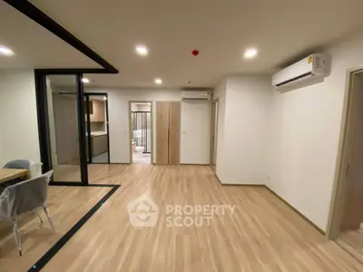 Spacious modern apartment with open layout and wooden flooring