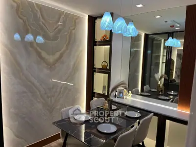 Luxurious dining area with elegant lighting and marble accents