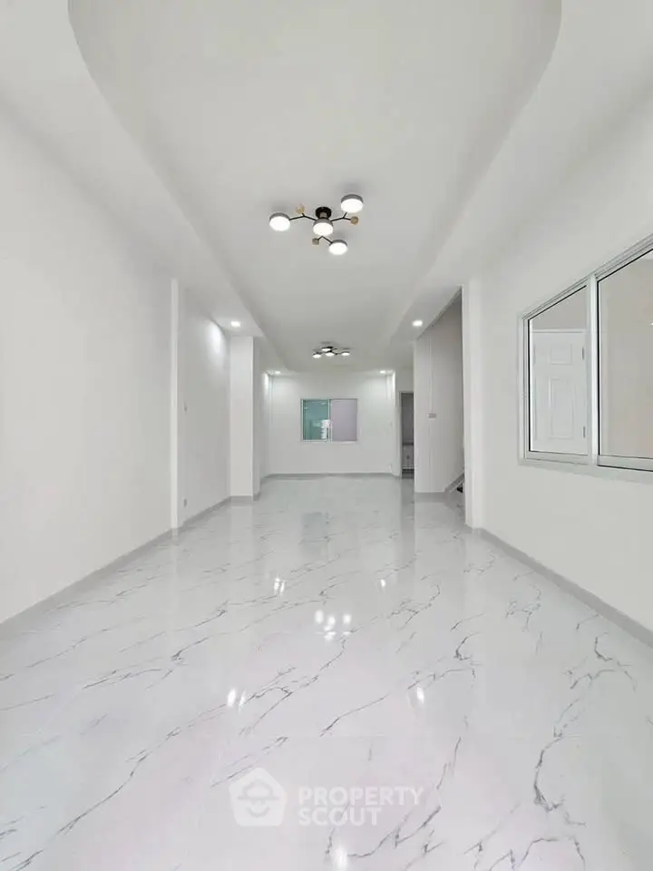 Spacious modern interior with marble flooring and elegant lighting