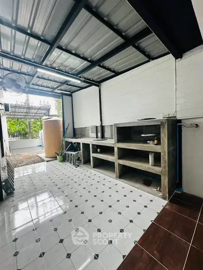 Spacious outdoor kitchen with modern design and ample storage space