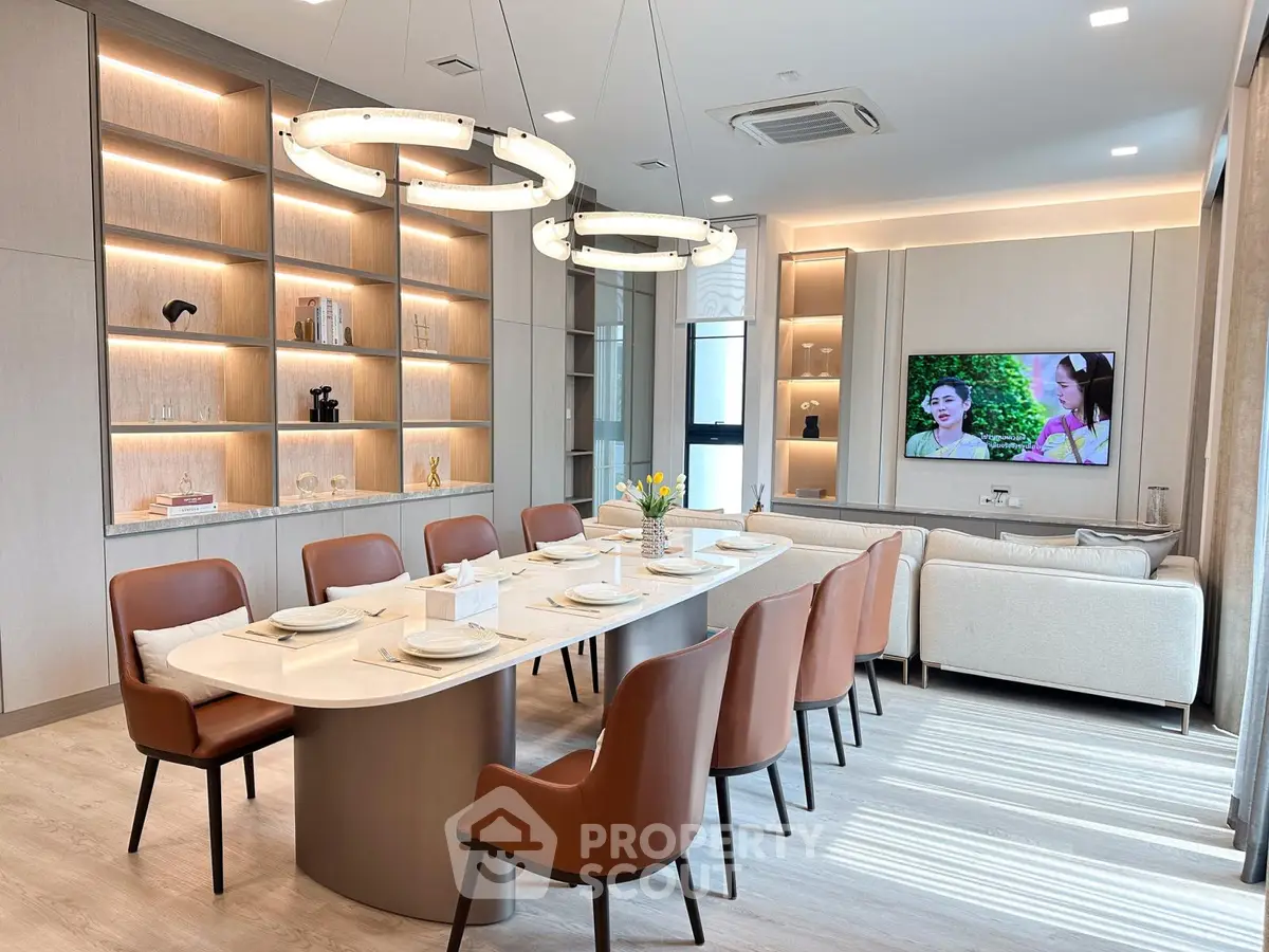 Luxurious modern dining and living room with elegant lighting and stylish furniture