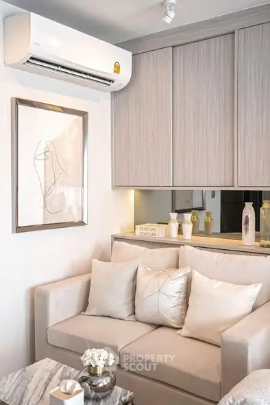 Modern living room with stylish decor and air conditioning unit