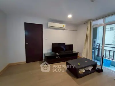 Modern living room with air conditioning and balcony access