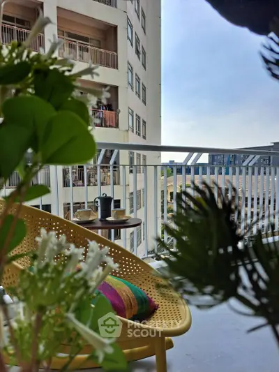 Charming balcony with stylish seating and city view, perfect for relaxation and enjoying urban living.