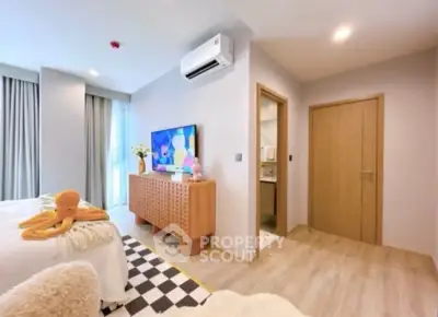 Modern bedroom with stylish decor and natural light, featuring a cozy ambiance and contemporary furnishings.