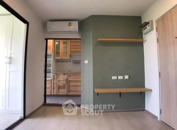 Modern apartment interior with sleek kitchen and air conditioning
