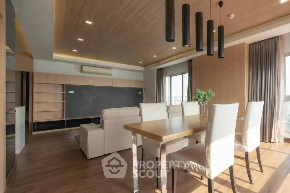 Spacious modern living room with elegant dining area and natural light