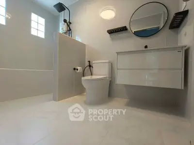 Modern bathroom with sleek fixtures and elegant tile flooring