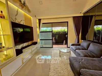 Luxurious living room with modern decor, plush sofa, and garden view through sliding glass doors.