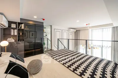 Modern bedroom with stylish decor and large windows in a contemporary apartment.