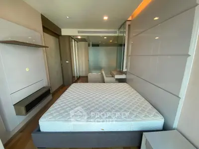 Modern bedroom with sleek design and spacious layout in a luxury apartment.
