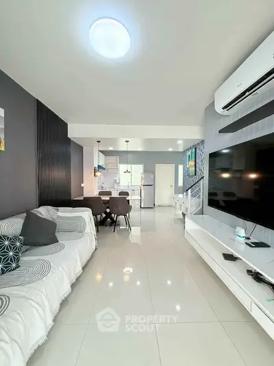 Modern living room with sleek design, open layout, and stylish furnishings.