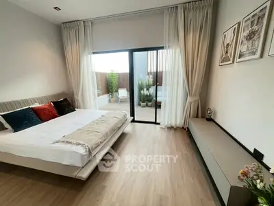 Luxurious bedroom with elegant decor and private balcony access