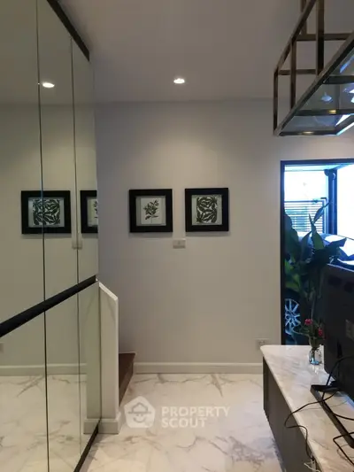 Modern interior hallway with elegant decor and marble flooring