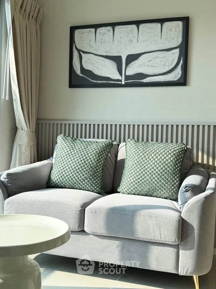 Cozy living room with stylish sofa and modern art decor