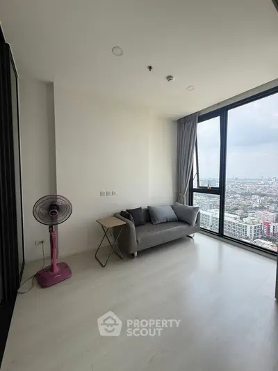 Modern living room with panoramic city view and minimalist decor