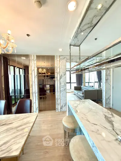 Luxurious modern living room with marble accents and elegant lighting