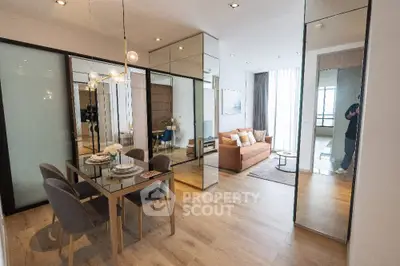 Modern open-plan living and dining area with stylish decor and ample natural light.