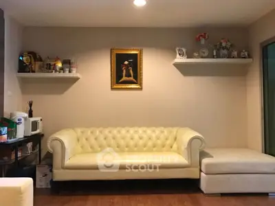 Cozy living room with elegant white sofa and decorative shelves