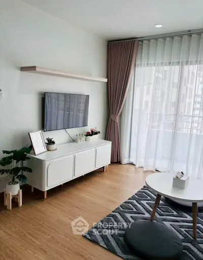 Modern living room with stylish decor and large window view