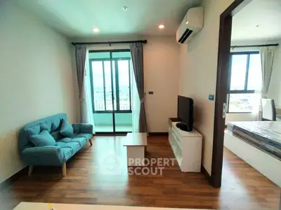 Modern living room with balcony view and stylish furniture