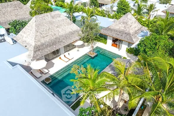 Luxurious tropical villa with private pool and lush greenery, perfect for serene living.