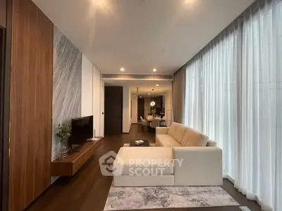Luxurious modern living room with elegant decor and large windows