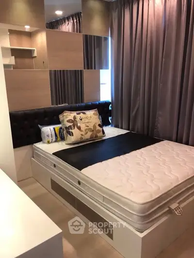 Modern bedroom with stylish decor and comfortable bed in a cozy apartment.