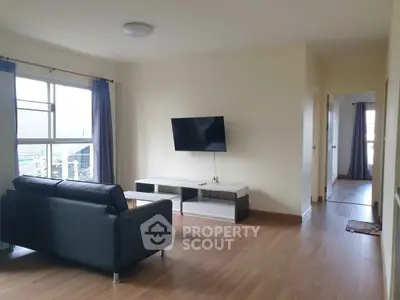 Spacious living room with modern decor and natural light