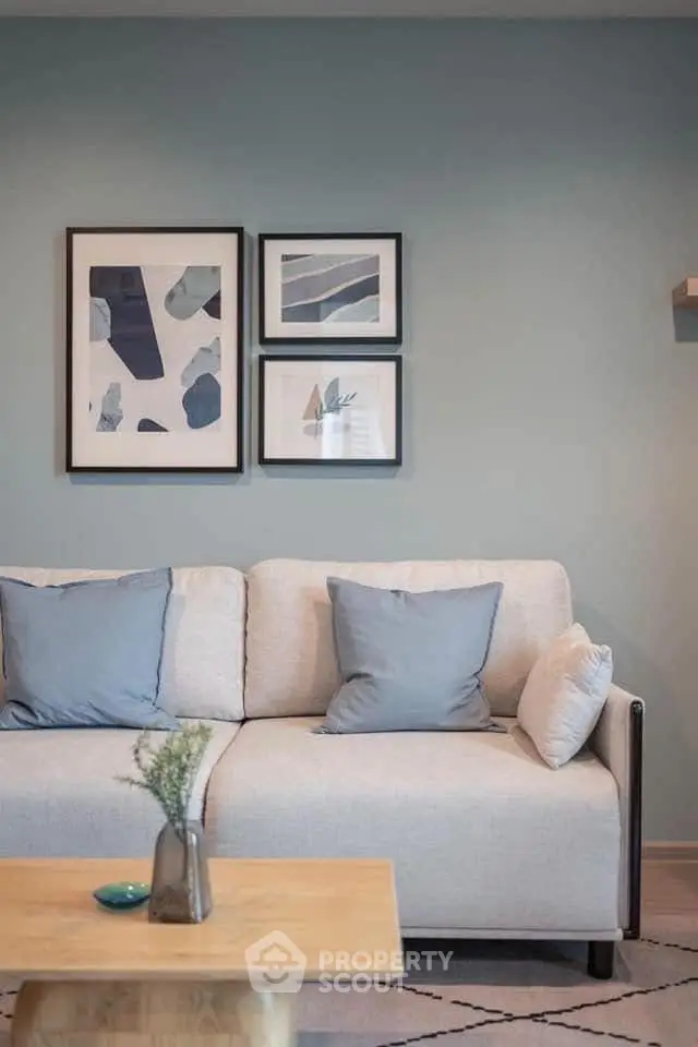 Stylish living room with modern decor and cozy sofa, perfect for relaxation.