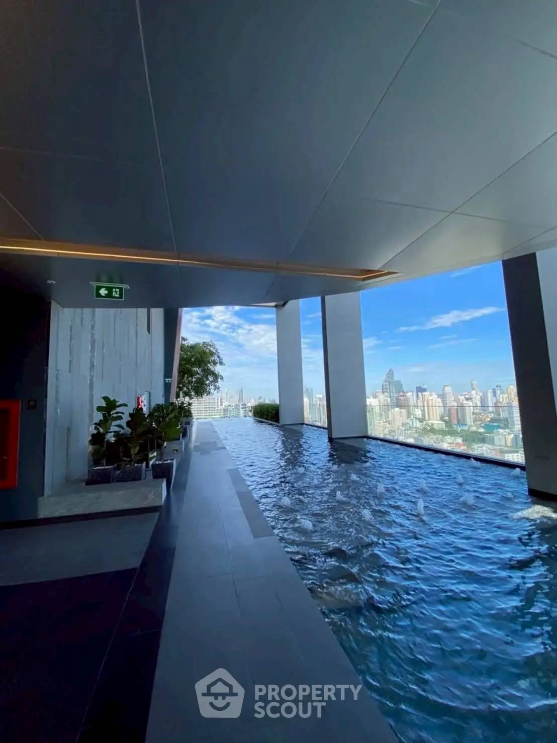 Luxurious rooftop infinity pool with stunning city skyline view