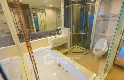 Luxurious bathroom with jacuzzi and modern shower in upscale apartment