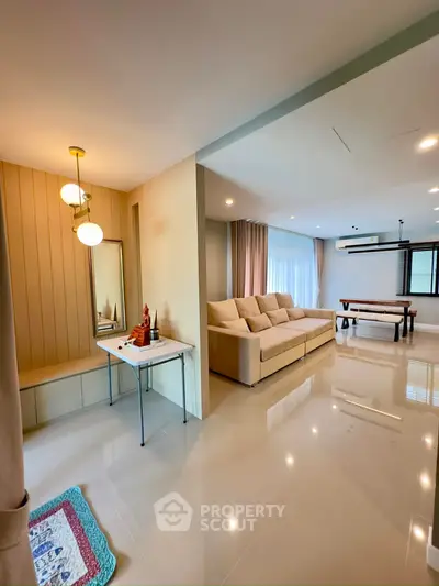 Spacious modern living room with elegant decor and ample natural light