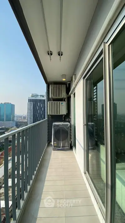 Spacious balcony with city view in modern high-rise apartment